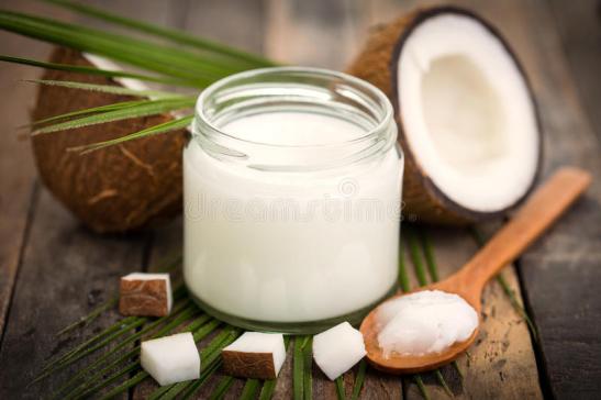 coconut-oil-wooden-table-84360102