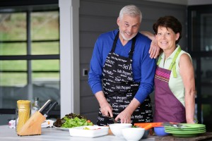 bigstock-senior-couple-cooking-at-home-12526475-300x200
